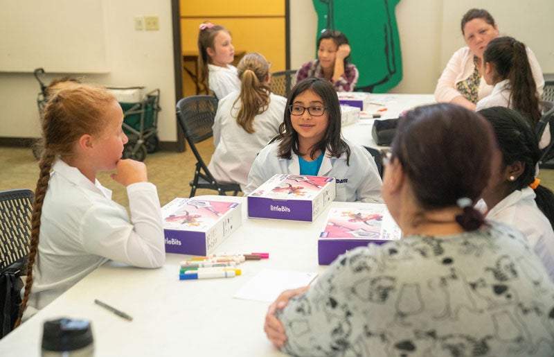 Girl Scouts interact with mentors