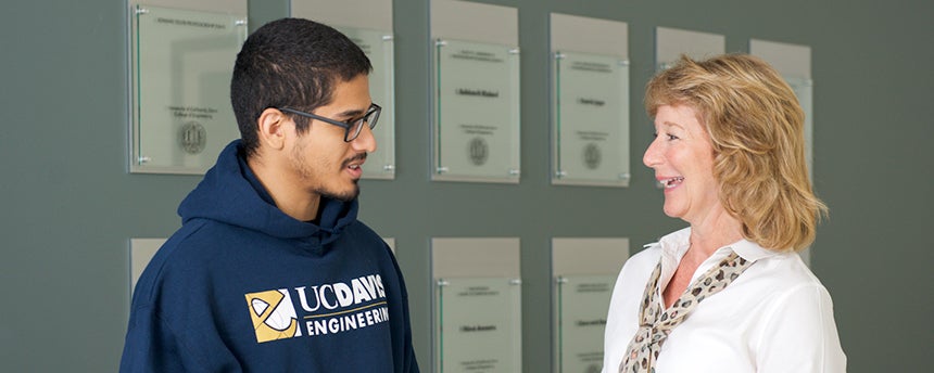 Dean Jennifer Sinclair Curtis, right, talking with a male student