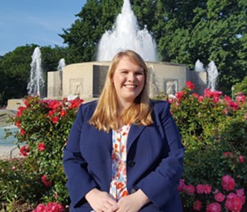Emily Karr, mathematical analytics and operations research major, sitting in front of a fountain in Washington, D.C.