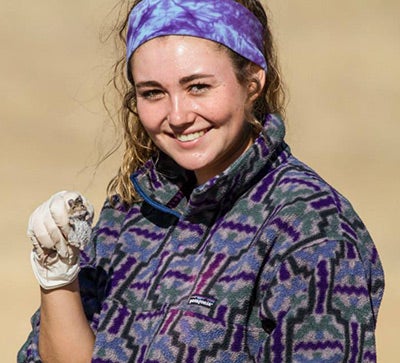 Thalia Badger holds a tiny mouse