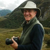 Alexander Harcourt in South America mountains with camera