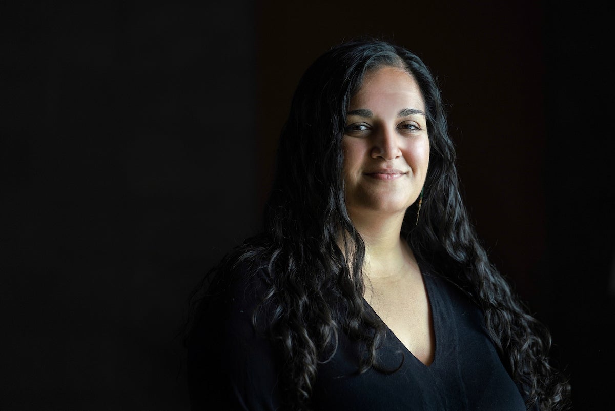 Profile of Alyssa Griffin with black shirt and black backdrop