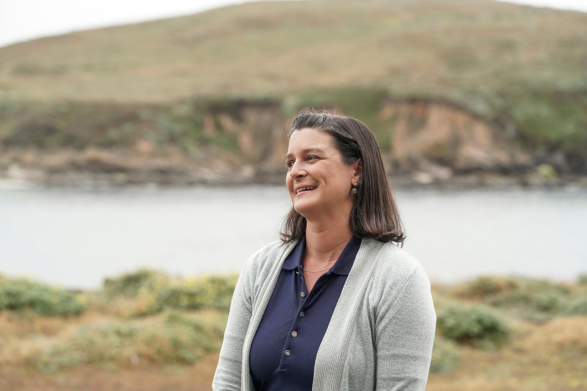 Climate scientist Tessa Hill smiles with Bodega Bay in background