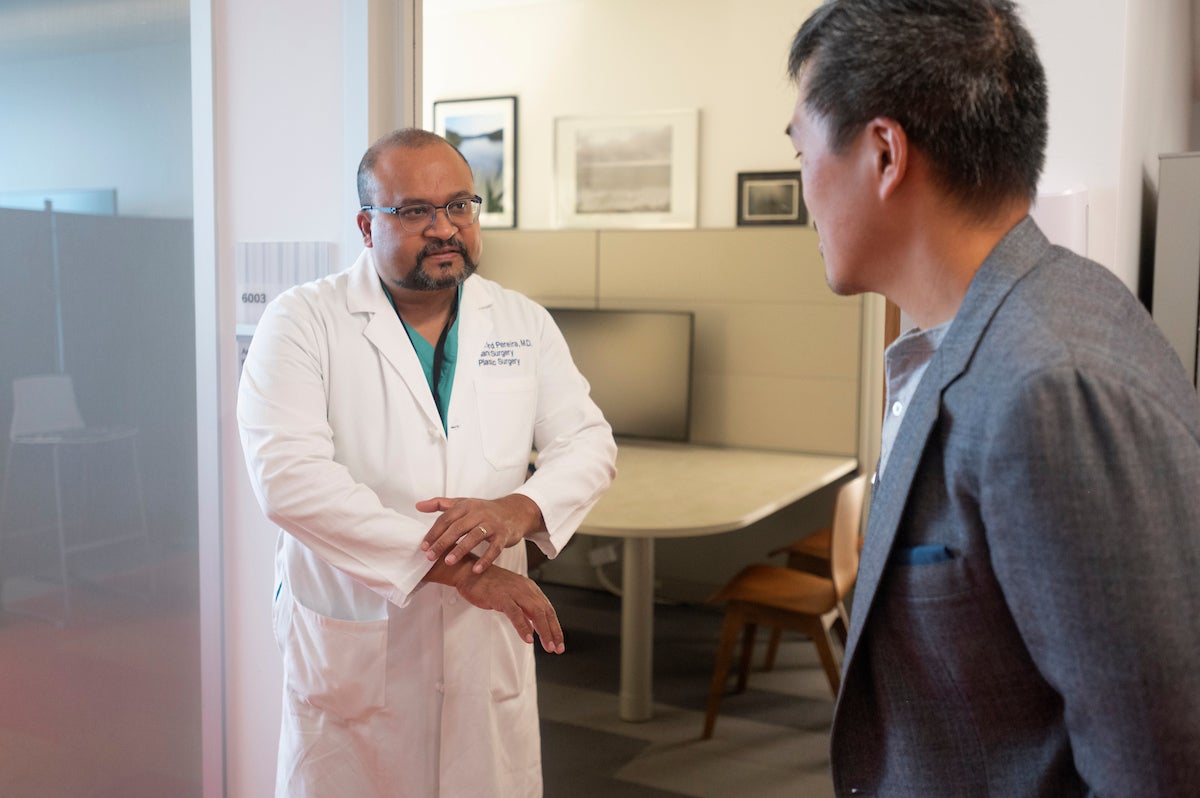 Cliff Pereira and Andrew Li are both with the Department of Surgery at UC Davis Health. They have performed targeted muscle re-innervation surgery to help amputees control prosthetic limbs more intuitively. (Greg Urquiaga/UC Davis)