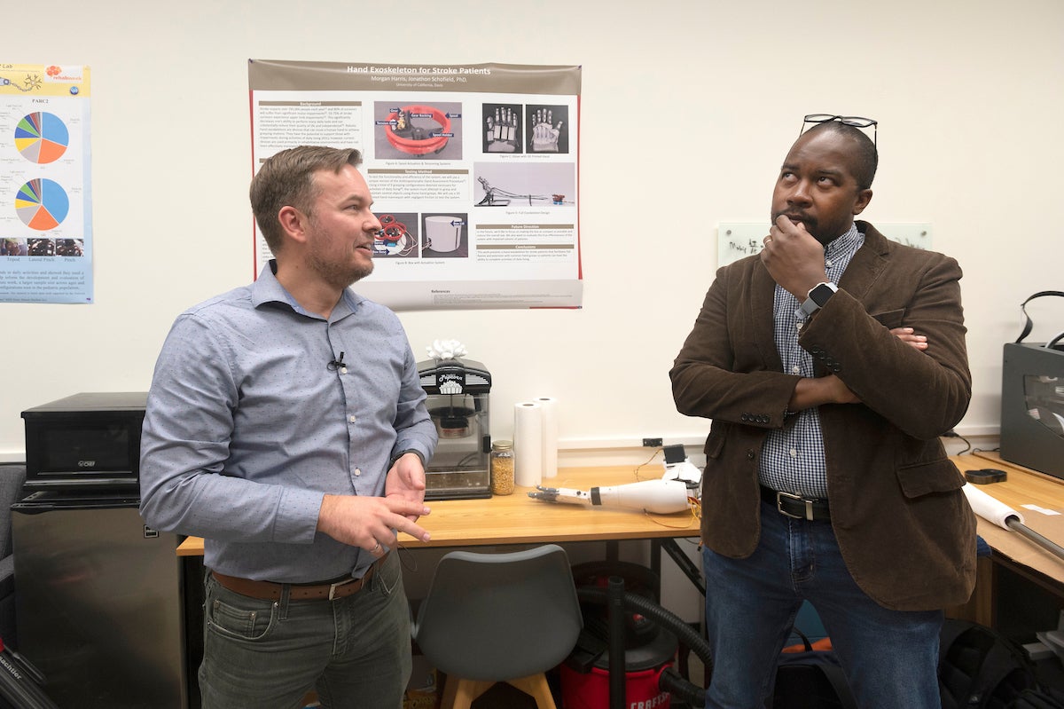 Engineer Jonathon Schofield, left, and neuroscientist Wilsaan Joiner, right, are both working to make prosthetic limbs more intuitive by incorporating what scientists know about how humans learn and control movement. (Greg Urquiaga/UC Davis)