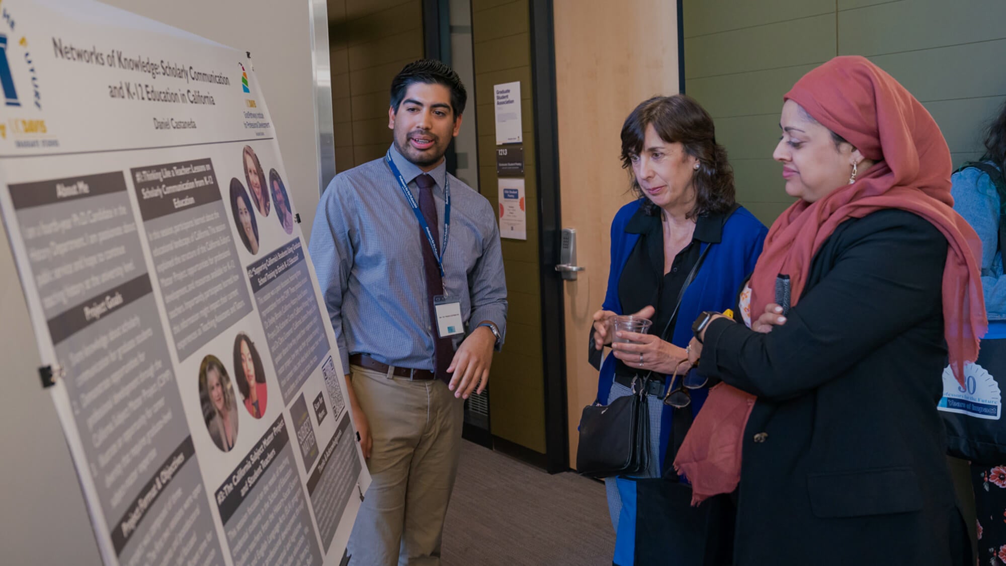 Daniel Cazares, a graduate student at UC Davis, discusses "Networks of Knowledge" and its impact on K-12 education during a research symposium. (TJ Ushing/UC Davis)