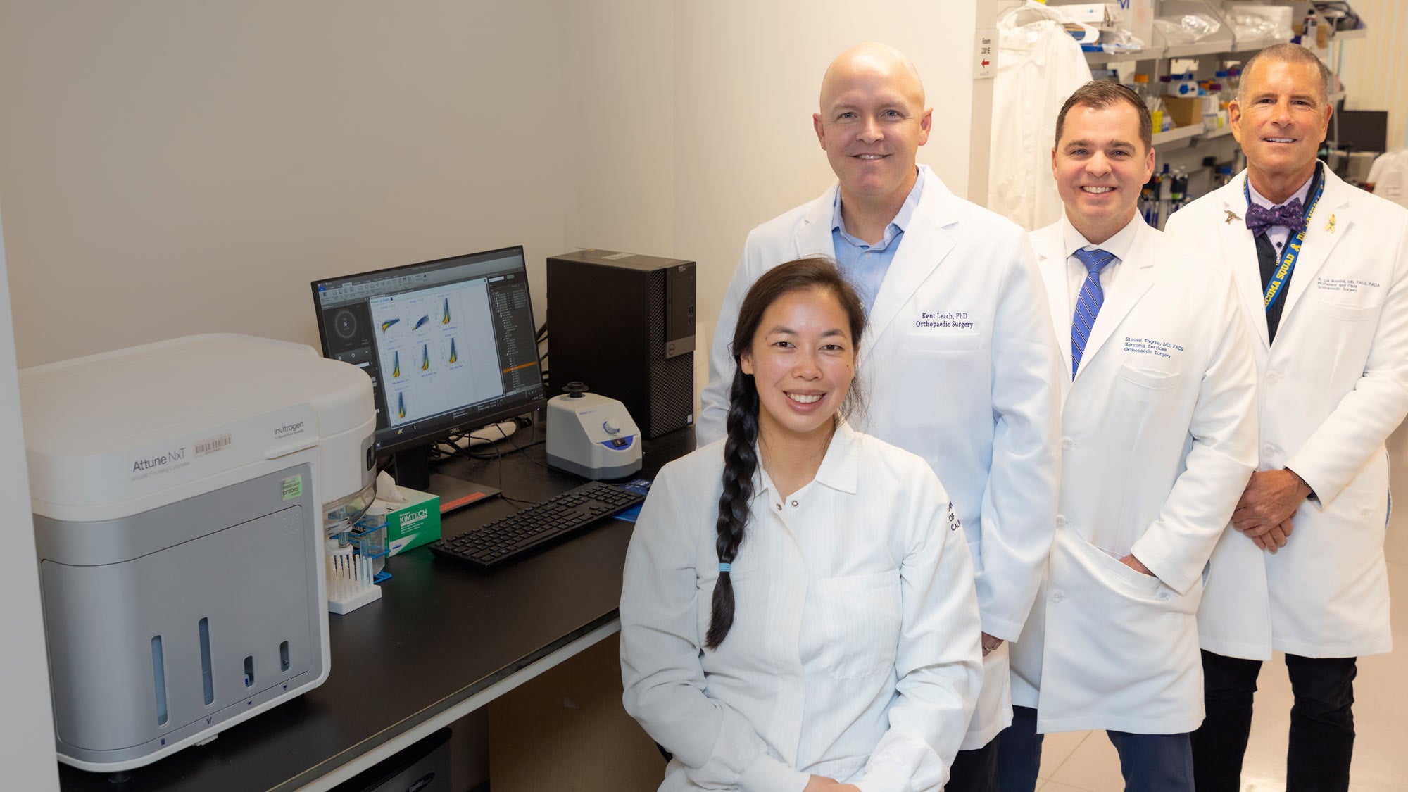Members of the UC Davis orthopedics engineered bone marrow research team, featuring (from left to right) Katherine Hartman Griffin, Kent Leach, Steven Thorpe and Lor Randall, collaborate in a laboratory setting. (UC Davis)