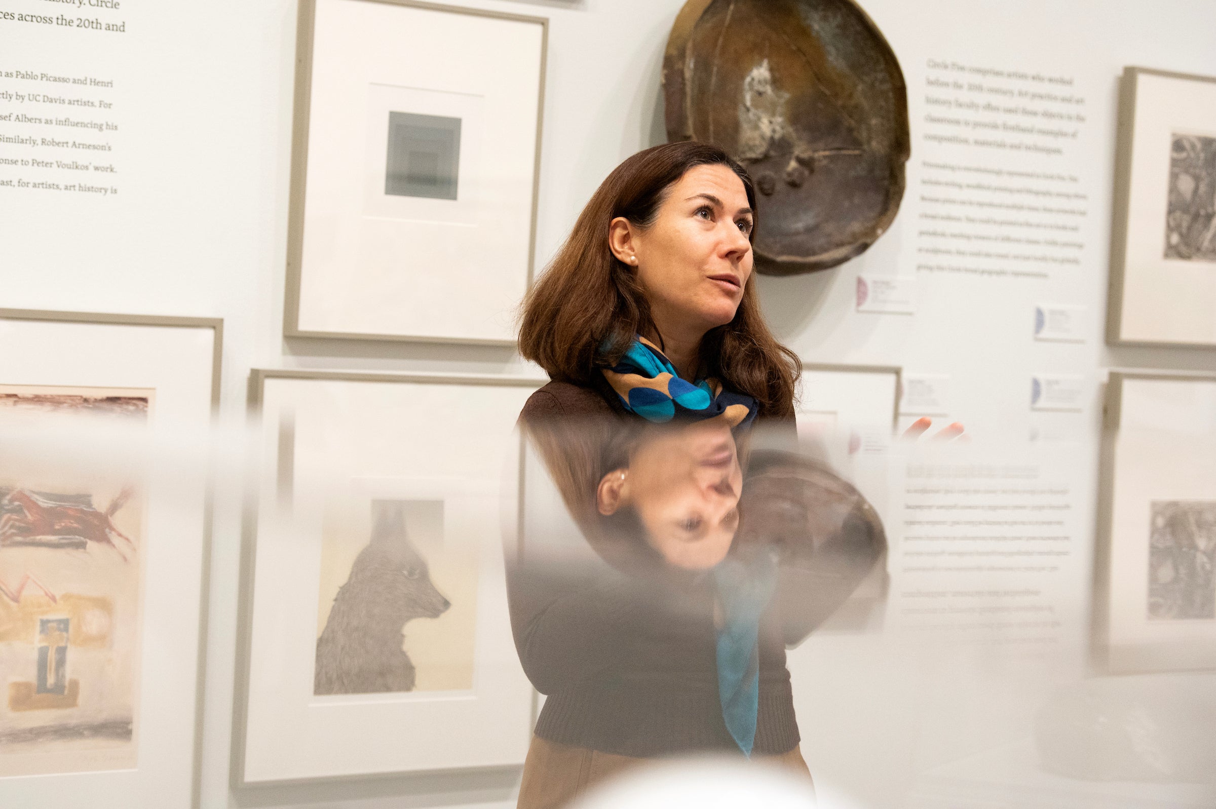 Assistant Professor Alexandra Sofroniew, instructor for practicum course, stands in art gallery. (Gregory Urquiaga/UC Davis) 