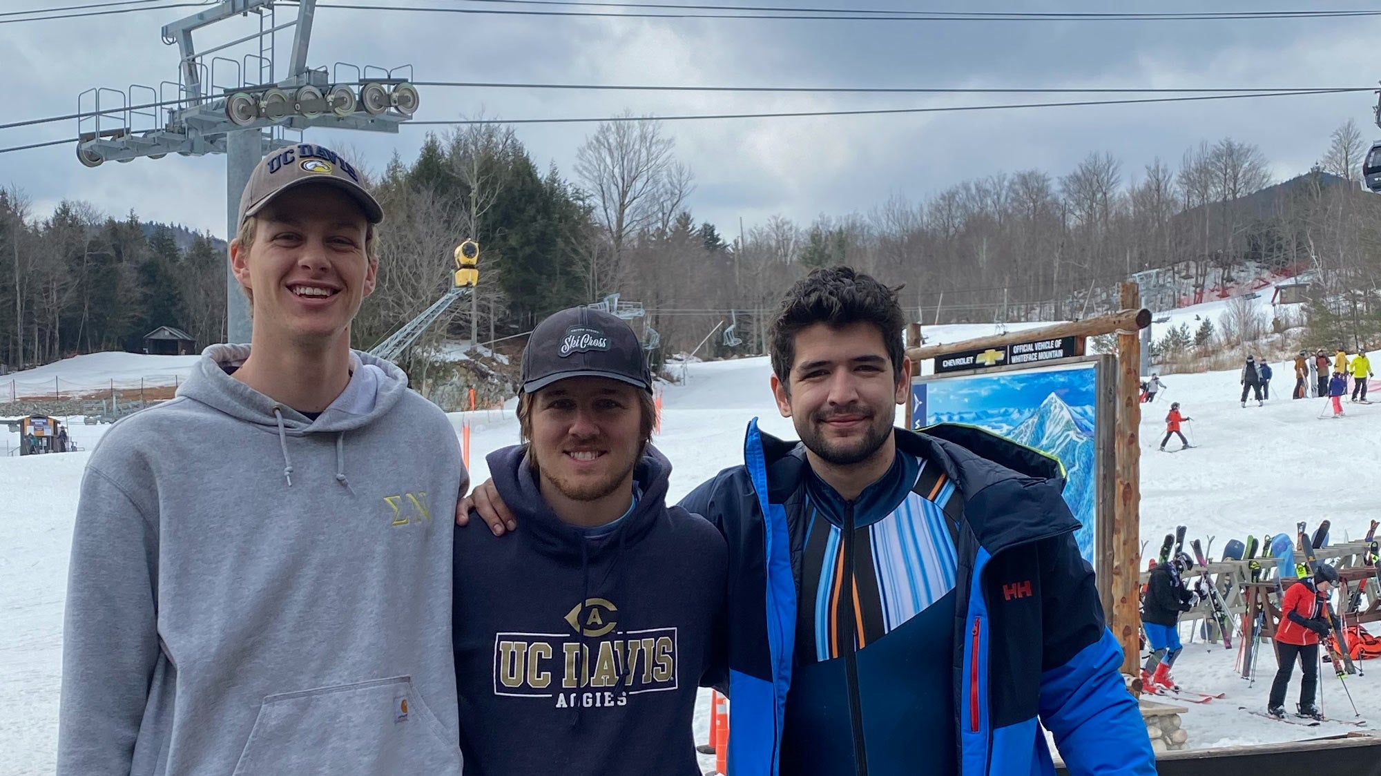3 men, lined up, pose, at ski resort