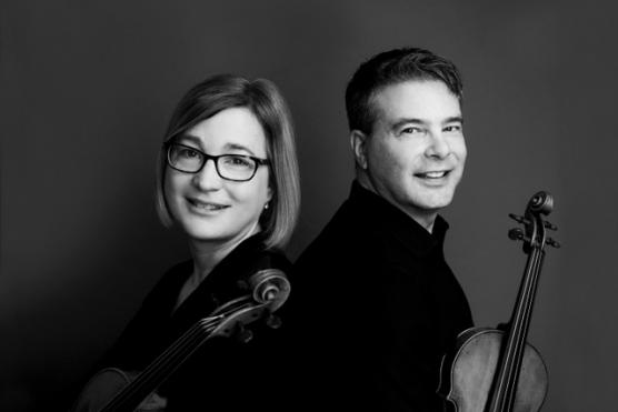 Two musicians in black and white portrait, side by side