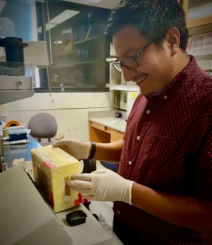 Grad student Gabriel Subuyuj in the lab