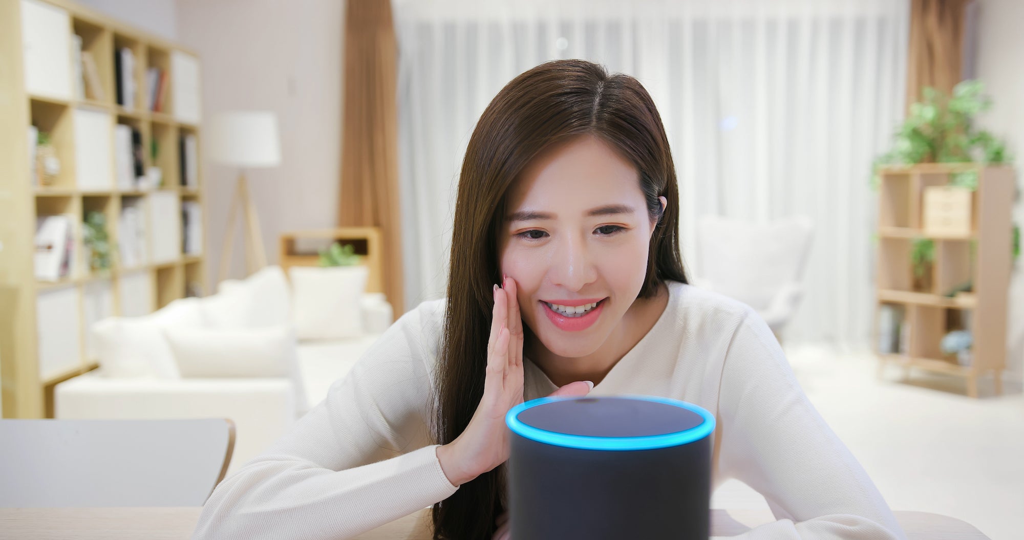 Woman speaking into her Alexa device. UC Davis researchers have found that people speak differently when talking with voice artificial intelligence.