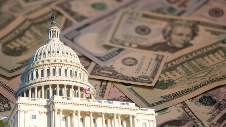Photo illustration of capitol with currency in background