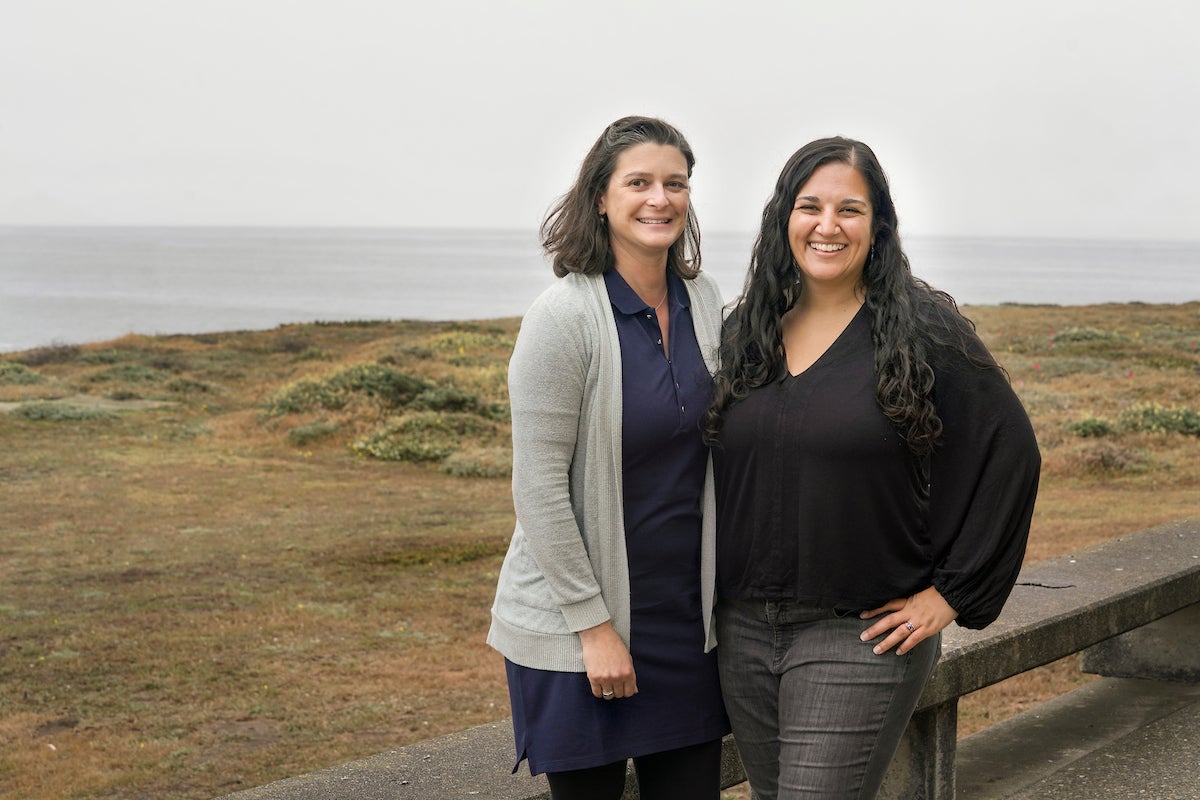 Climate scientists Tessa Hill and Alyssa Griffin outside with Bodega Bay in background