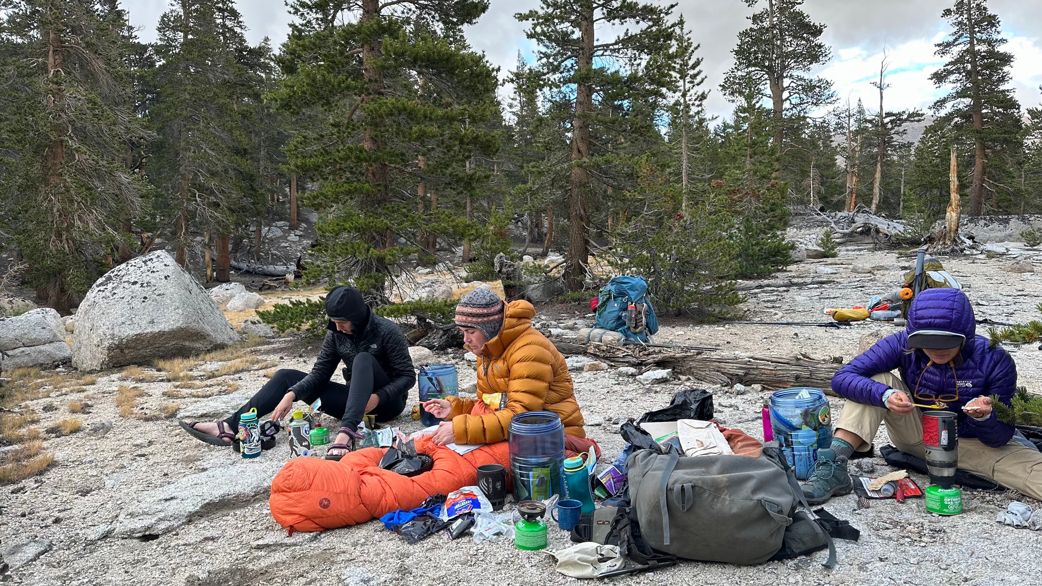 Grace Cureton and her team of researchers eat dinner after a long day of backpacking