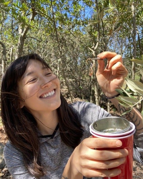 Mia Lippey smiling at an insect