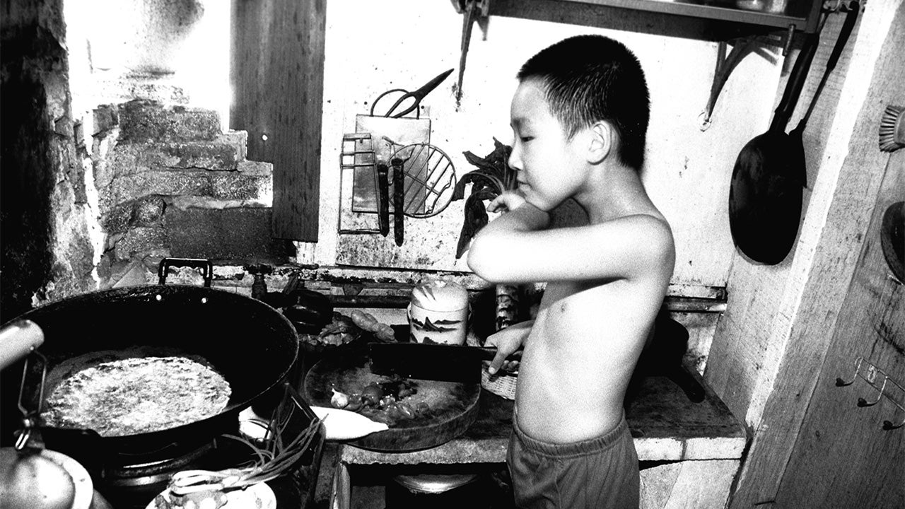 Martin Yan, age 9, in his home kitchen in China