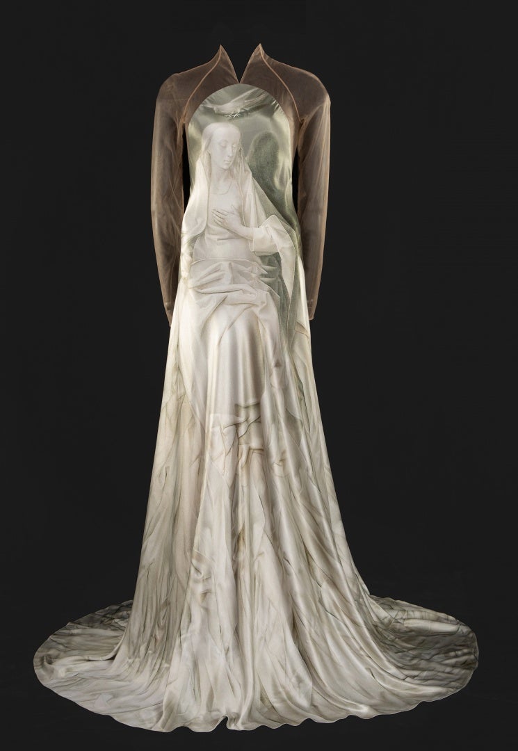 White gown on mannequin is part of fashion art exhibit