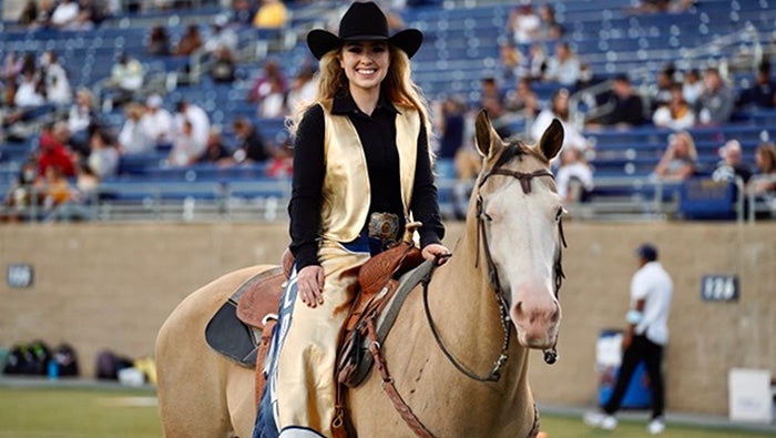 McKensey Middleton dressed in “Maggie the Aggie” costume while riding her horse, Sugar