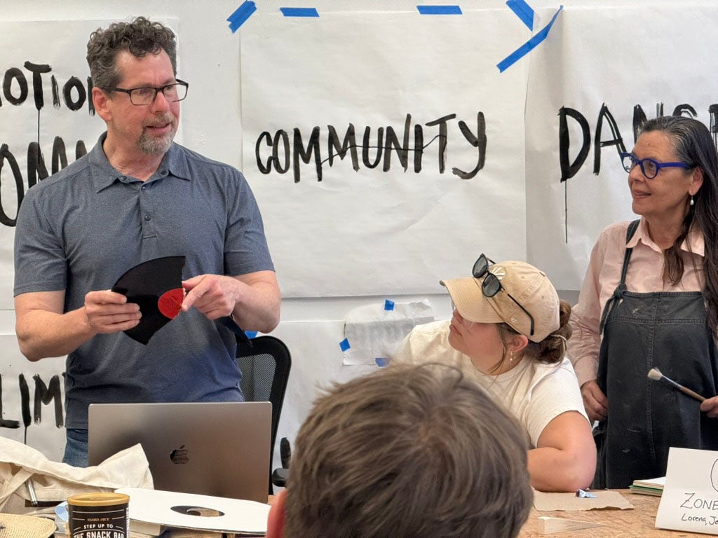 Music Professor Kurt Rohde and Art Professor Robin Hill interact with students (Courtesy)