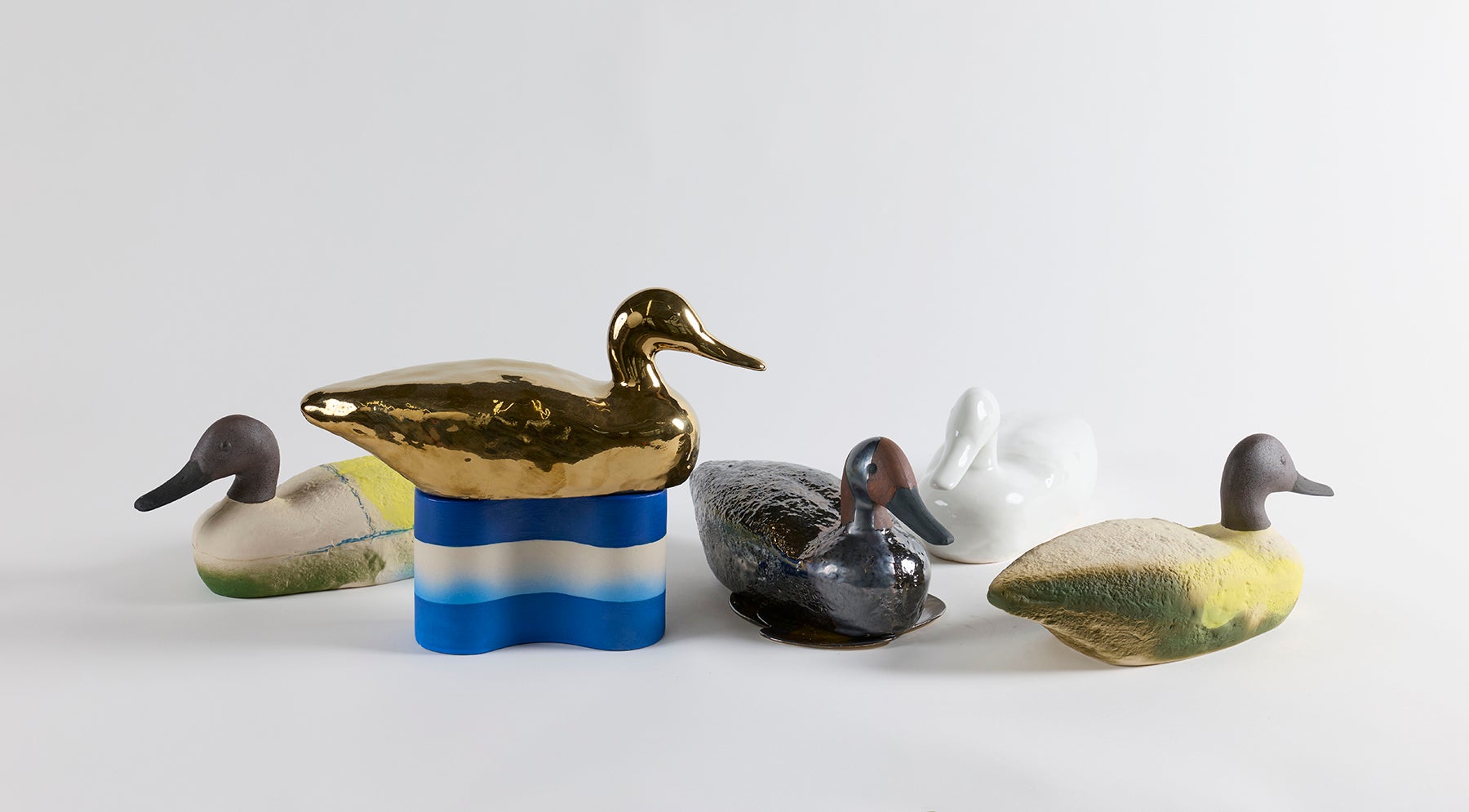 duck decoy sculptures colorfully painted