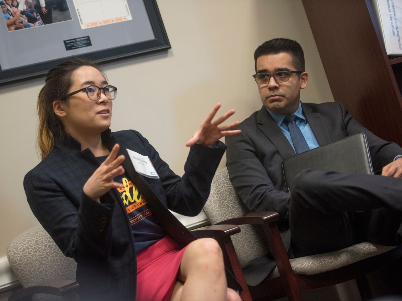 California State Senator Janet Nguyen sits in an office, passionately addressing a delegation from UC Irvine.
