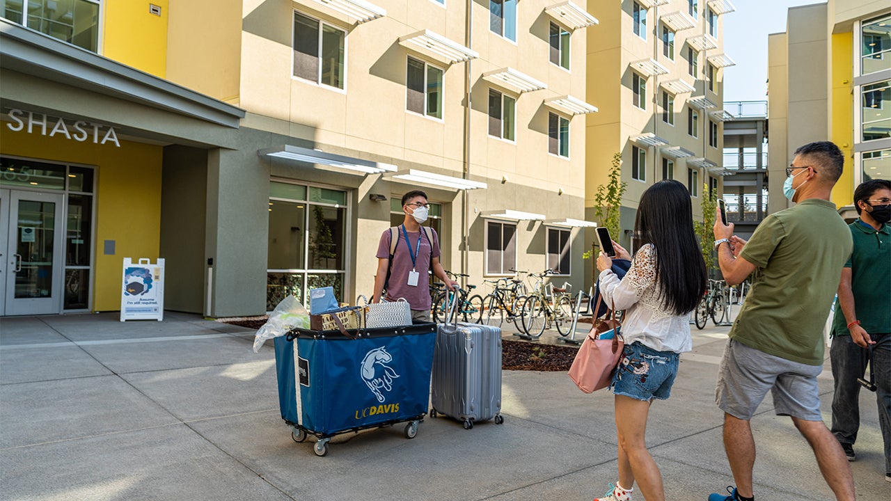 A student poses for a photo outside Shasta  Hall in September 2021.