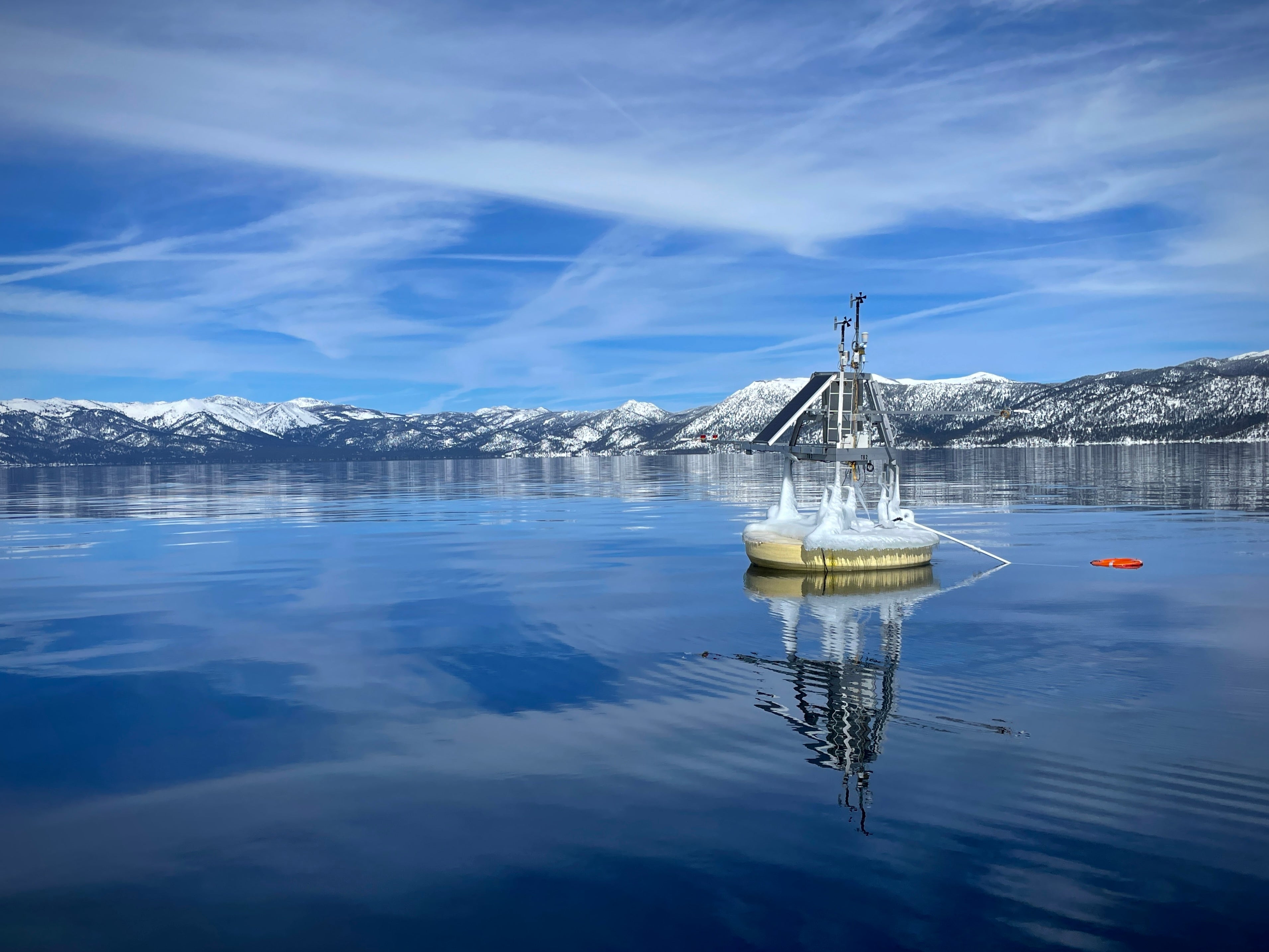 Buoy with scientific instruments floats in wintry Lake Tahoe water