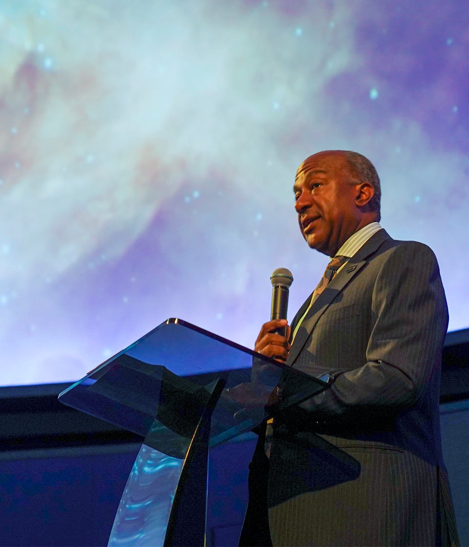 Chancellor Gary S. May speaks at podium