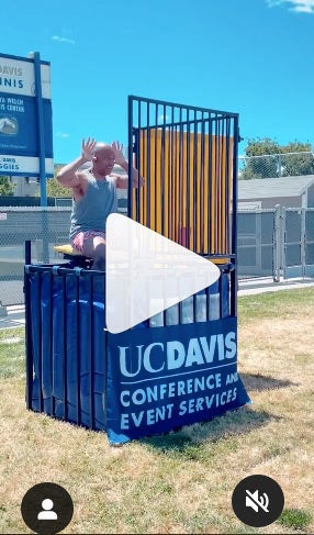 Screenshot of Instagram post with Chancellor May in dunk tank