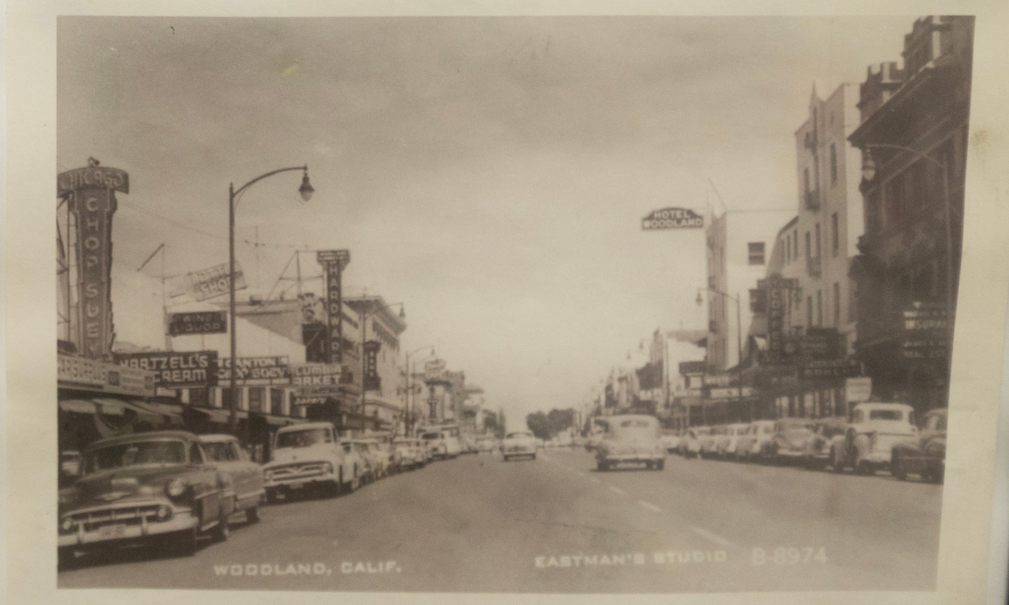 Black and white image of Woodland's Main Street in the mid-20th century