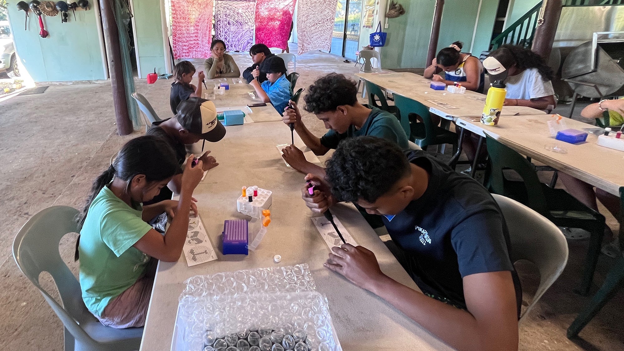 members of Kōrero O Te 'Ōrau, where participants ranging from 8 to 25 years old learn skills such as how to measure photosynthesis and how to extract DNA.