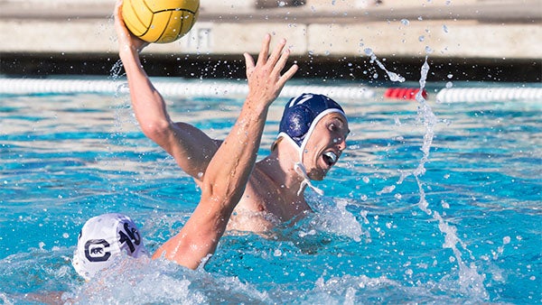 Water polo player throws ball