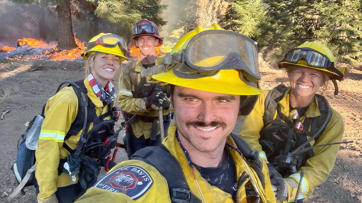 Fire crew poses for selfie.