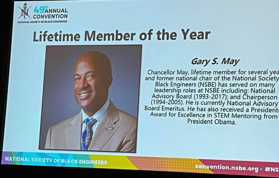 Chancellor Gary S. May is pictured on a slide announcing his selection as NSBE Lifetime Member of the Year