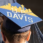 A closeup of the back of a head with a graduation cap on it.