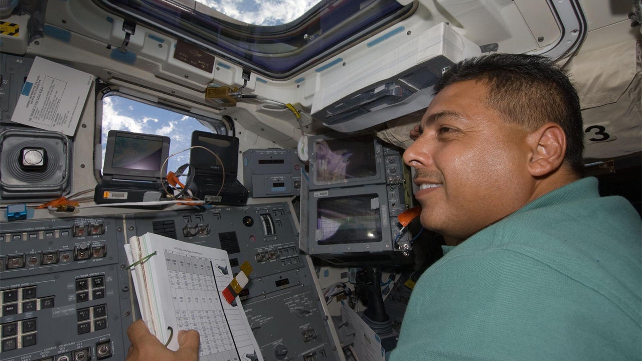 José Hernandez on the aft flight deck of Space Shuttle Discovery