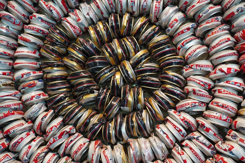 Closeup of artwork with beverage cans in a circle