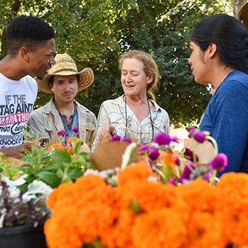 director of uc davis student farm photographed with student interns
