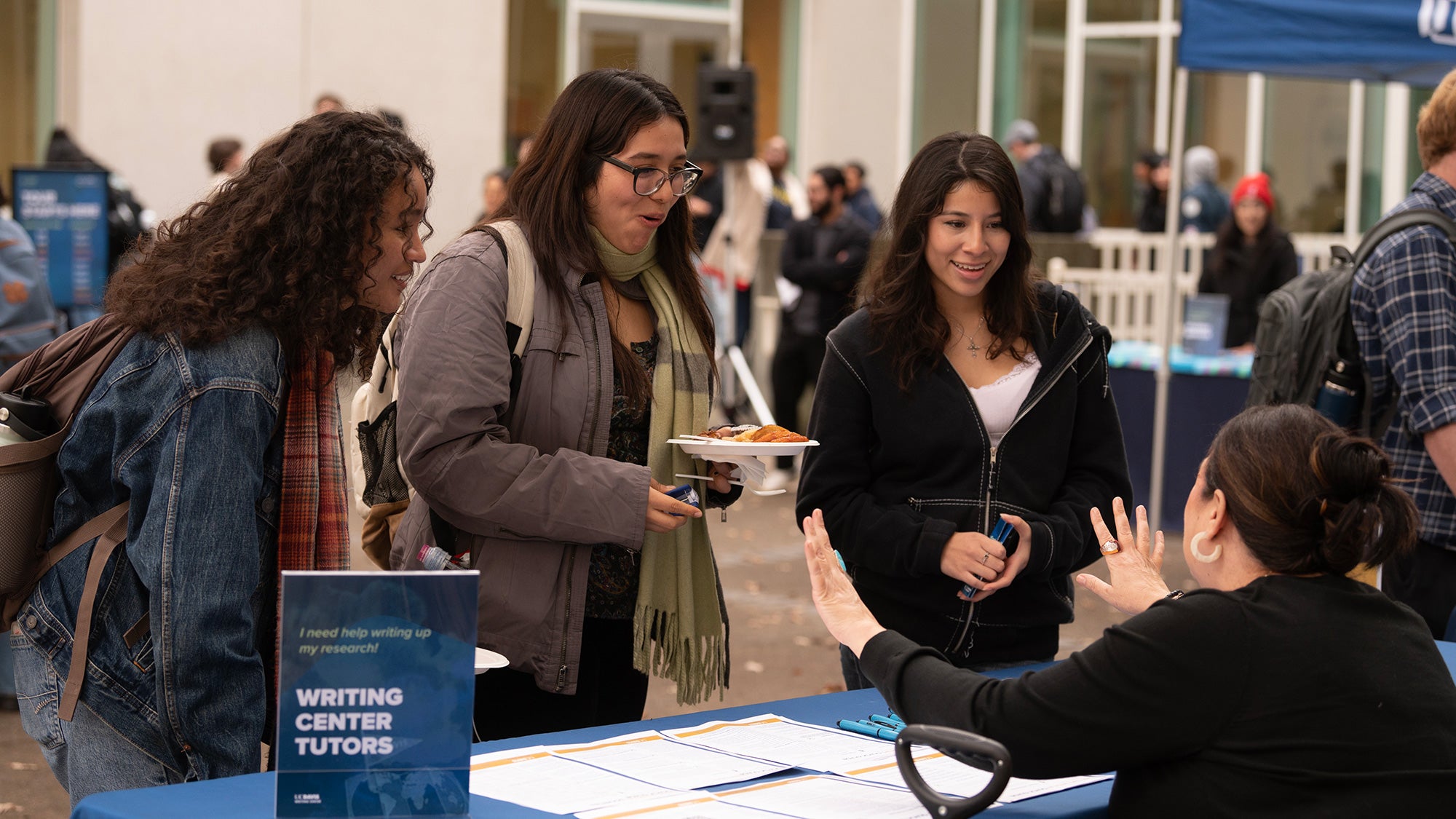 Students attend an international open house at the library