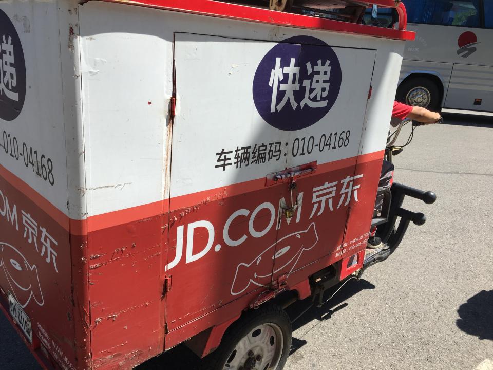 A JD.com delivery cycle brings goods to customers in China.