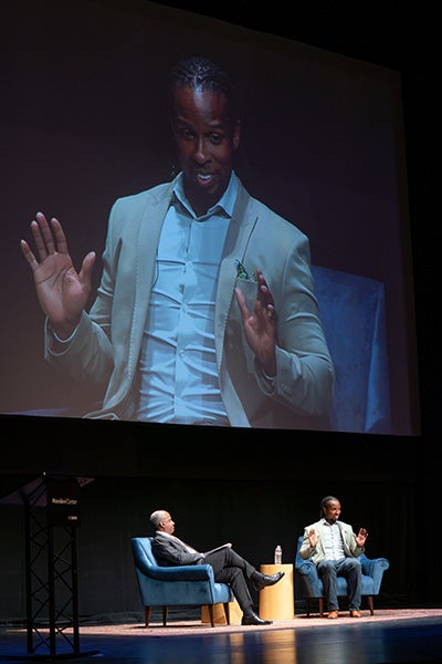 Screen shows Ibram X. Kendi during his talk with Chancellor Gary S. May