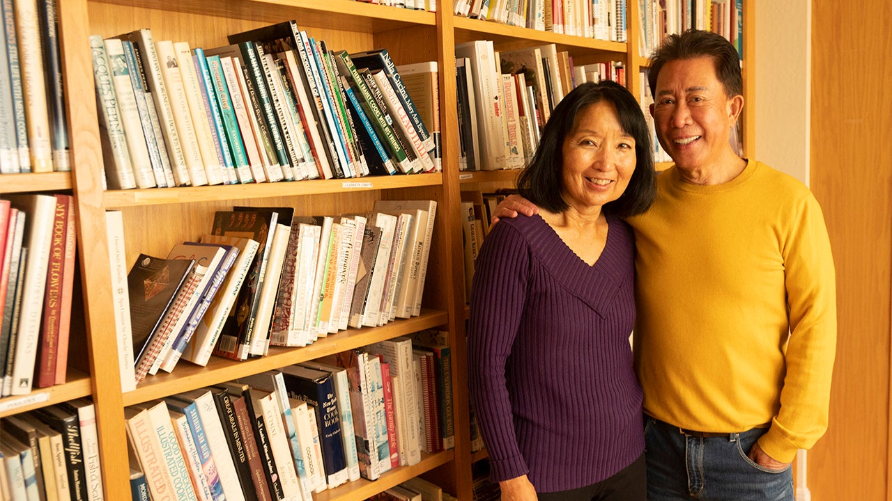 Martin and Susan Yan with some of the chef's cookbooks