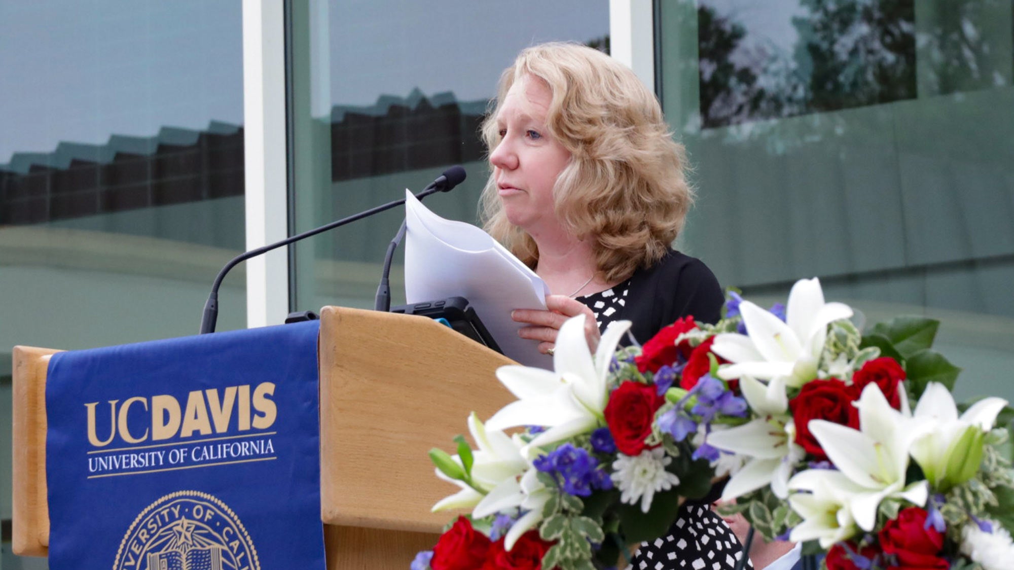 Woman speaks from UC Davis podium