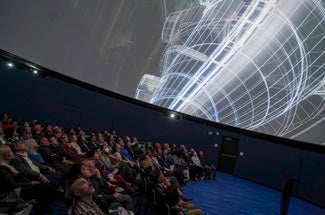 Audience looks up to ceiling of UC Davis Multiverse Theater for film screening