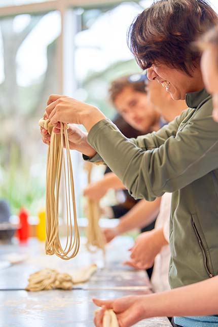 Students stretch noodles