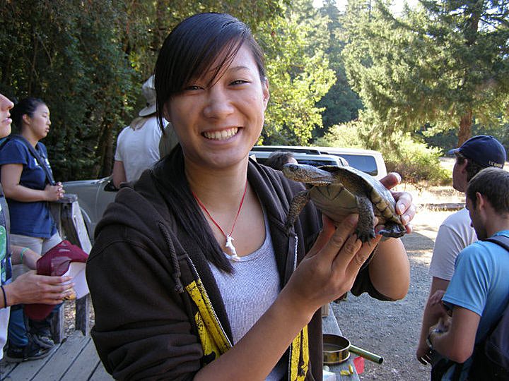 Vickie hold a turtle at UC Davis. 
