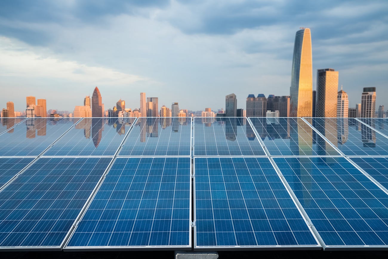 Rooftop Solar Panels overlooking City Skyline