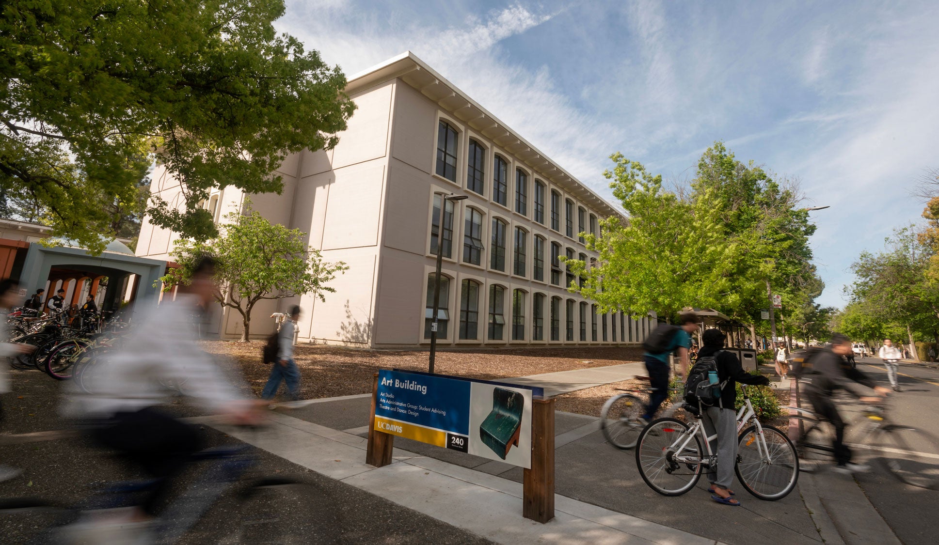 Arts Building at UC Davis with bicyclists riding by