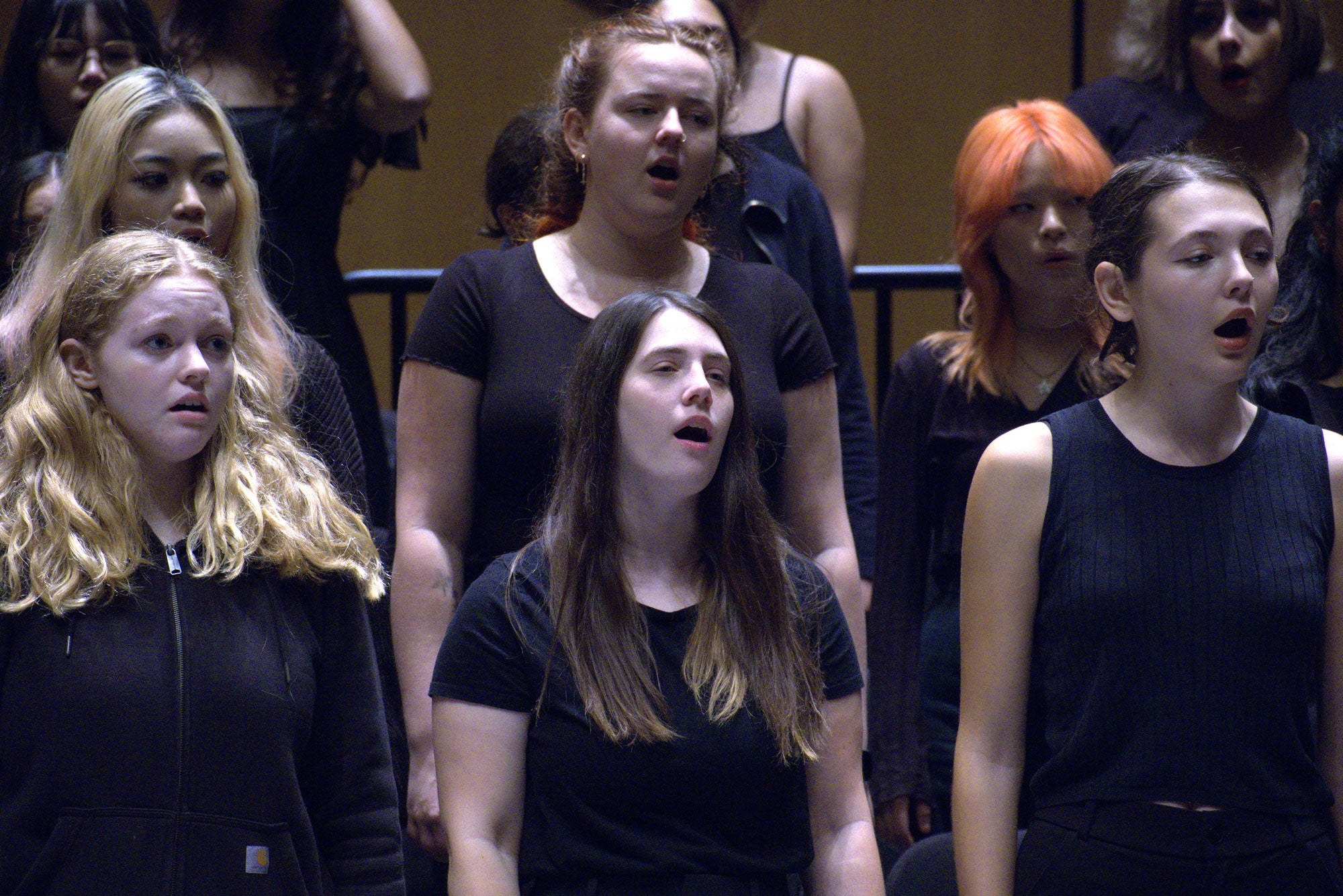 Women in chorus singing